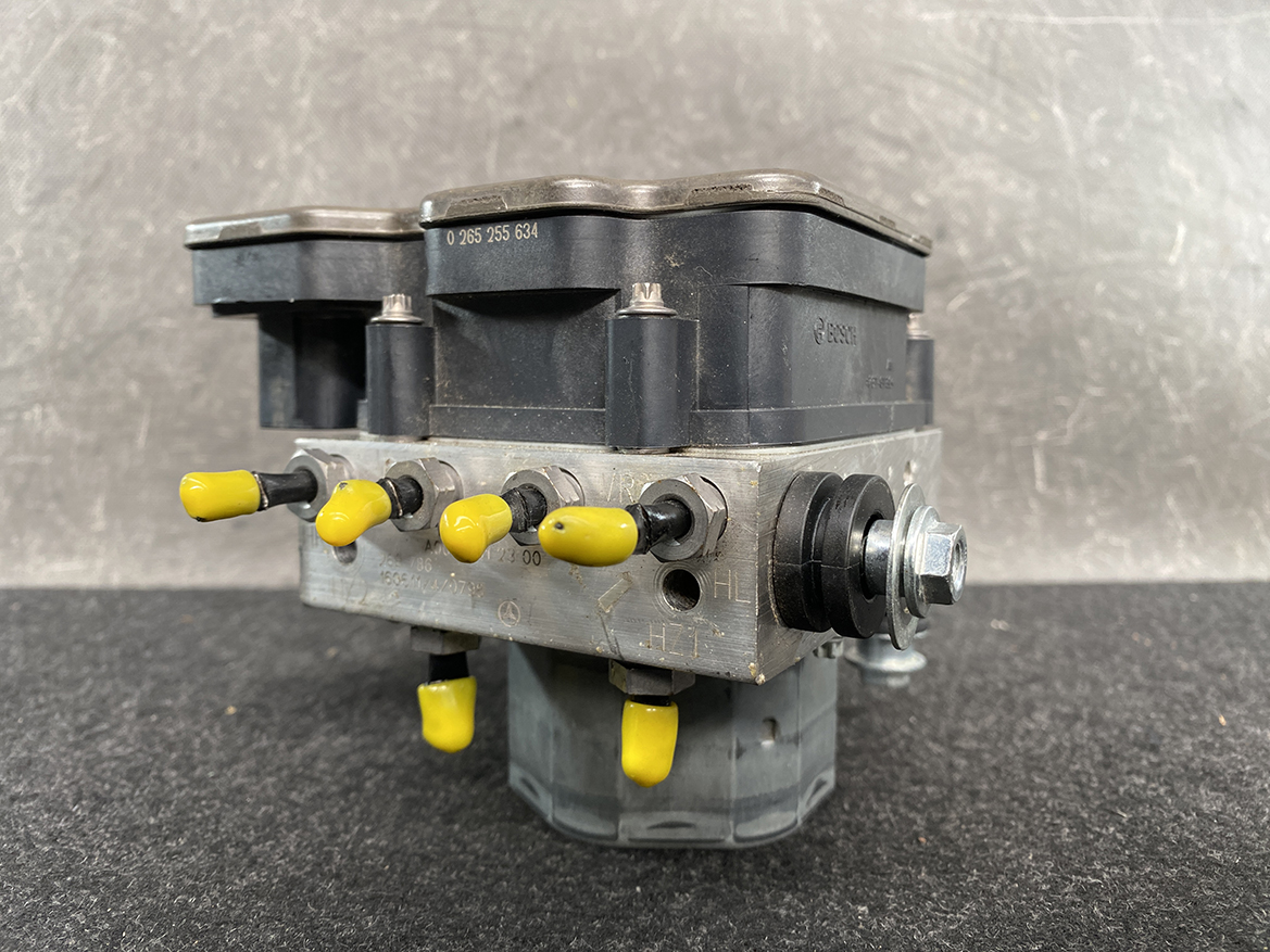 BNZ-ACTR-A000431 _2 Mercedes Benz Genuine ABS Actuator Pump A000 431 23 00 / 0 265 255 634 » NZ9.95 » JDM-PARTS NZ » JDM-PARTS NZ Bosch-branded ABS actuator module with a black plastic top and yellow valve levers on a metal block Mercedes Benz Genuine ABS Actuator Pump A000 431 23 00 / 0 265 255 634 » JDM-PARTS NZ