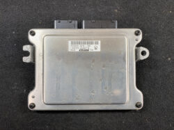 Automotive engine control unit (ECU) with a metal silver housing, mounting lugs on sides and a barcode label on top surface.