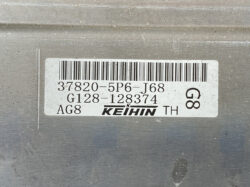 Close-up of a KEIHIN label with barcode and alphanumeric codes on a metal surface.
