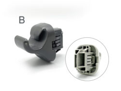 Close-up of a gray plastic electrical connector with a built-in latch, labeled 'B' nearby on the left side.