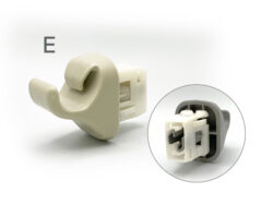 Beige LEGO-like connector piece with a circular clip and a hollow interior shown in close-up, against a white background.