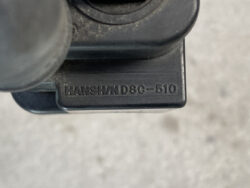 Close-up of a black plastic component with the engraved text 'HANSHIN DSC-510'.