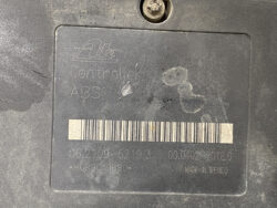 Label on an ABS control module with barcode and serial numbers, made in Mexico