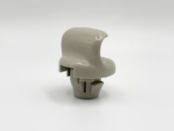 Gray plastic knob-like component with curved top, shown from the side on a white background.