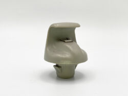 Beige plastic car interior door handle with a small latch on a white background