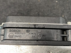 Close-up of a Bosch automotive component with part numbers 201010 and Ma40 embossed on black plastic.