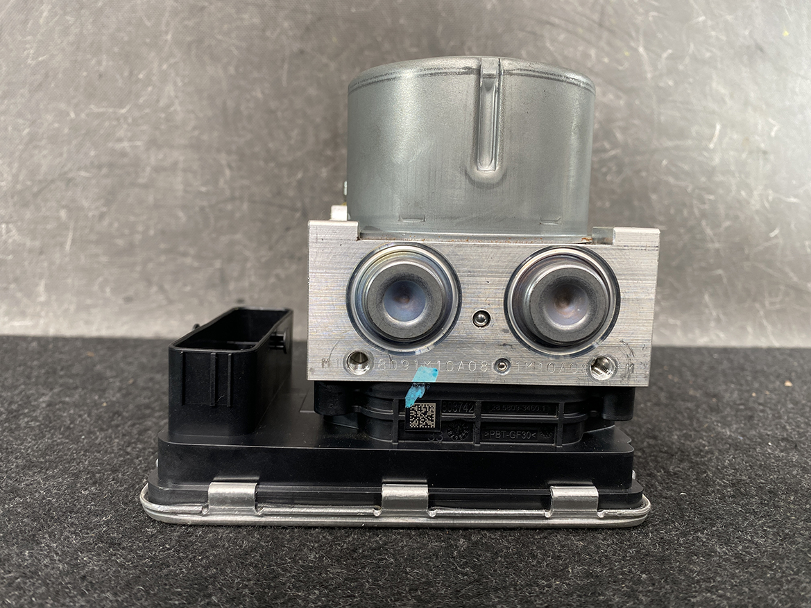 SUB-ACTR-FL140 _9 Subaru Impreza Genuine ABS Actuator Pump 27536FL140 » NZ9.95 » JDM-PARTS NZ » JDM-PARTS NZ Automotive brake ABS module with two solenoid pistons mounted on a metal block and a black plastic base with a connector on the left side Subaru Impreza Genuine ABS Actuator Pump 27536FL140 » JDM-PARTS NZ