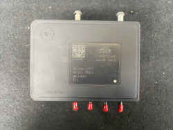 Compact black controller module labeled 'Controller' with red terminal pins; likely an ECU/relay component for a vehicle. Includes Made in Mexico and ESC markings.