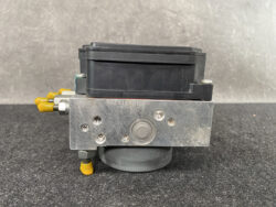 Industrial hydraulic control valve with a black solenoid coil on top and yellow port fittings