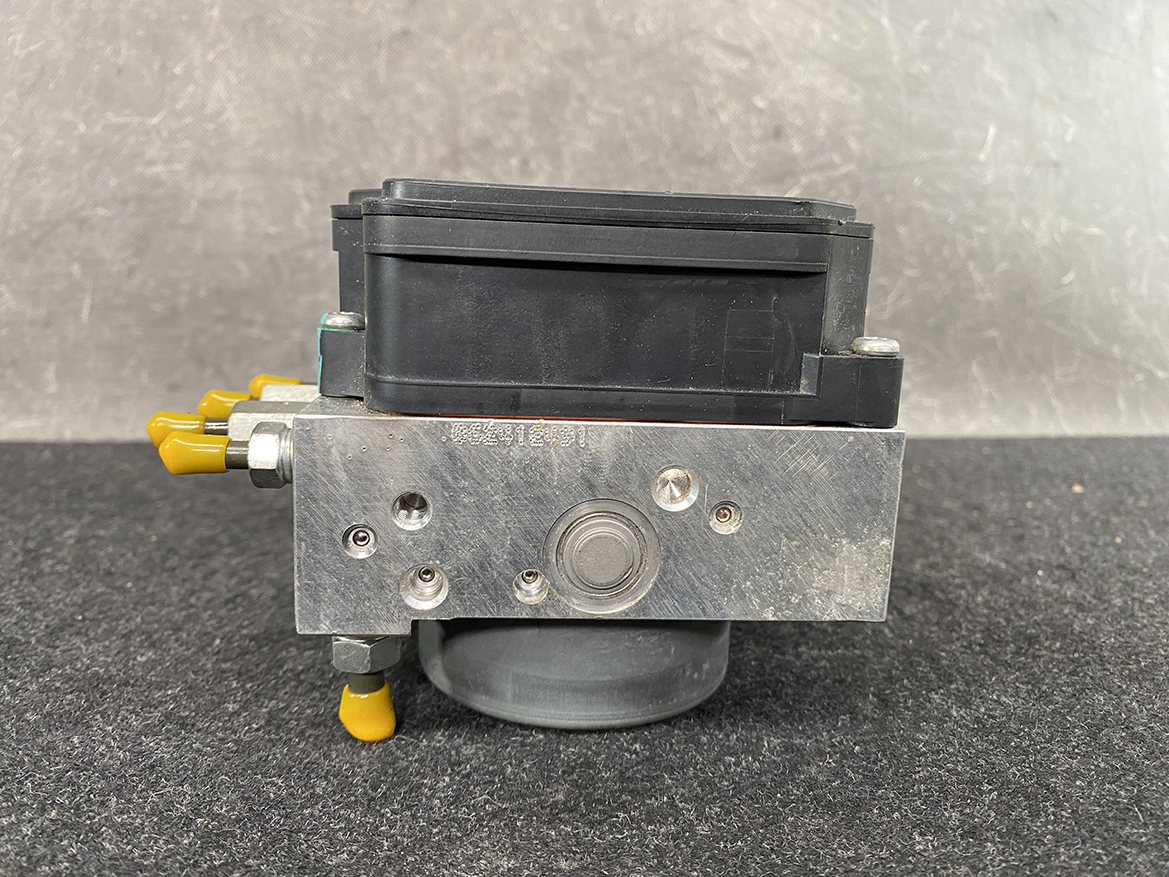 SUZ-ACTR-74PR _5 Suzuki Alto Genuine ABS Actuator Pump / 56110-74PR / 116040-40581 » NZ9.95 » JDM-PARTS NZ » JDM-PARTS NZ Industrial hydraulic control valve with a black solenoid coil on top and yellow port fittings Suzuki Alto Genuine ABS Actuator Pump / 56110-74PR / 116040-40581 » JDM-PARTS NZ