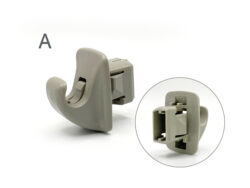 Two angles of a gray plastic clamp-style fastener with a locking slot in the center. (Informative close-up)