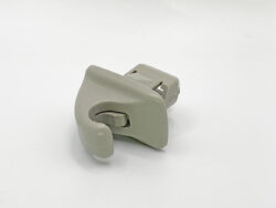 Gray plastic locking clip with a curved jaw, shown on a white background (side view).