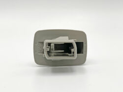 Close-up of a gray plastic rectangular connector housing with a central white receptacle slot.