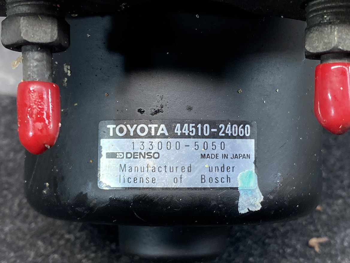 TOY-ACTR-24060_3 Toyota Chaser Altezza Genuine ABS Actuator Pump 44510-24060 / 133000-5050 » NZ9.95 » JDM-PARTS NZ » JDM-PARTS NZ Close-up of a car part label: TOYOTA 44510-24060 with Denso, Made in Japan, showing licensing under Bosch. Toyota Chaser Altezza Genuine ABS Actuator Pump 44510-24060 / 133000-5050 » JDM-PARTS NZ