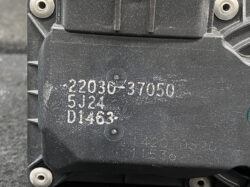 Close-up of a black plastic component with embossed part numbers: 22030-37050, 5J24, D1463.