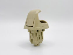 Beige plastic modular component standing upright on a white background, with interlocking tabs and a curved top edge.