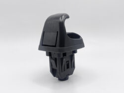 Black plastic lever-style component with a curved top, likely a vehicle gear selector or control switch, on a white background.