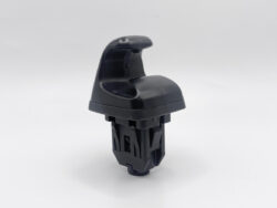 Black plastic automotive clip with a curved top and interlocking base.