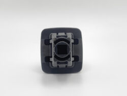 Square black plastic connector housing with a circular central receptacle seen from the front.