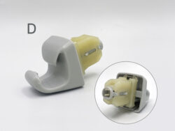 Close-up of a gray plastic housing with a yellow battery-like component partially inserted. TOYOTA Genuine Sun Visor Clip/ Holder / Retainer #D » JDM-PARTS NZ