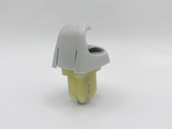Gray plastic housing clipped over a yellow connector component on a white background.