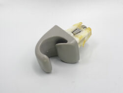 Gray orthodontic appliance component (retainer/bite guard) on a white background with yellow connectors at the back