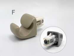 Close-up of a beige plastic medical device part with a gray connector; inset circles show the inner housing.