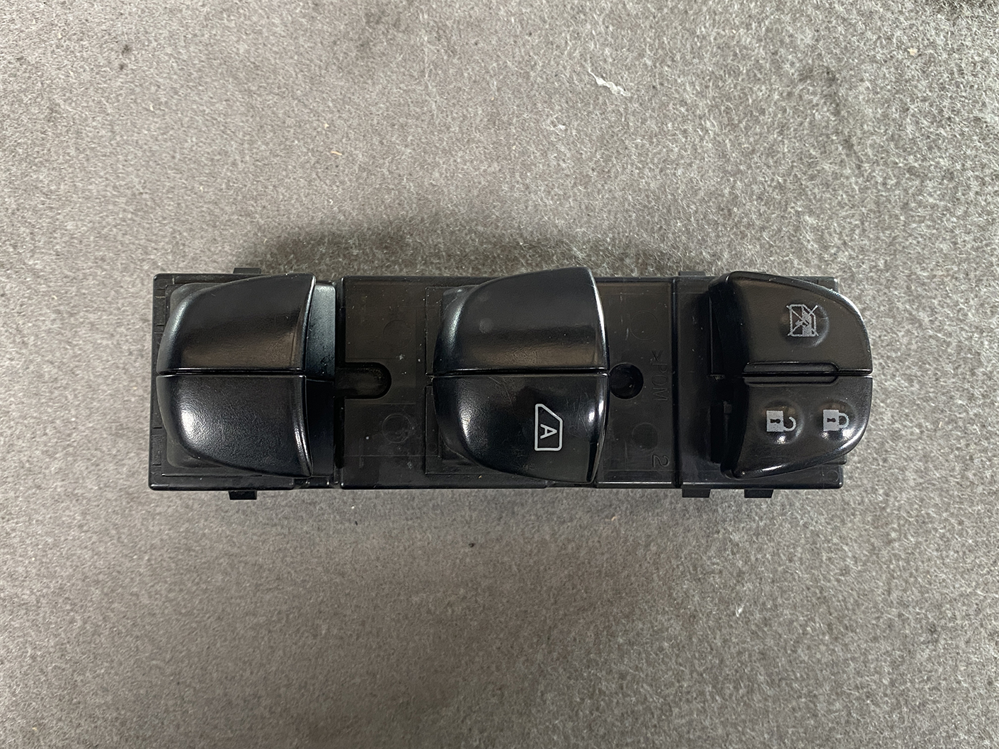 B488_3 NISSAN SERENA SUZUKI LANDY C26 Genuine Master Power Window Switch 25401 1VA7A » NZ.95 » JDM-PARTS NZ » JDM-PARTS NZ Car power window switch panel with four window controls and lock buttons on a black plastic base NISSAN SERENA SUZUKI LANDY C26 Genuine Master Power Window Switch 25401 1VA7A » JDM-PARTS NZ