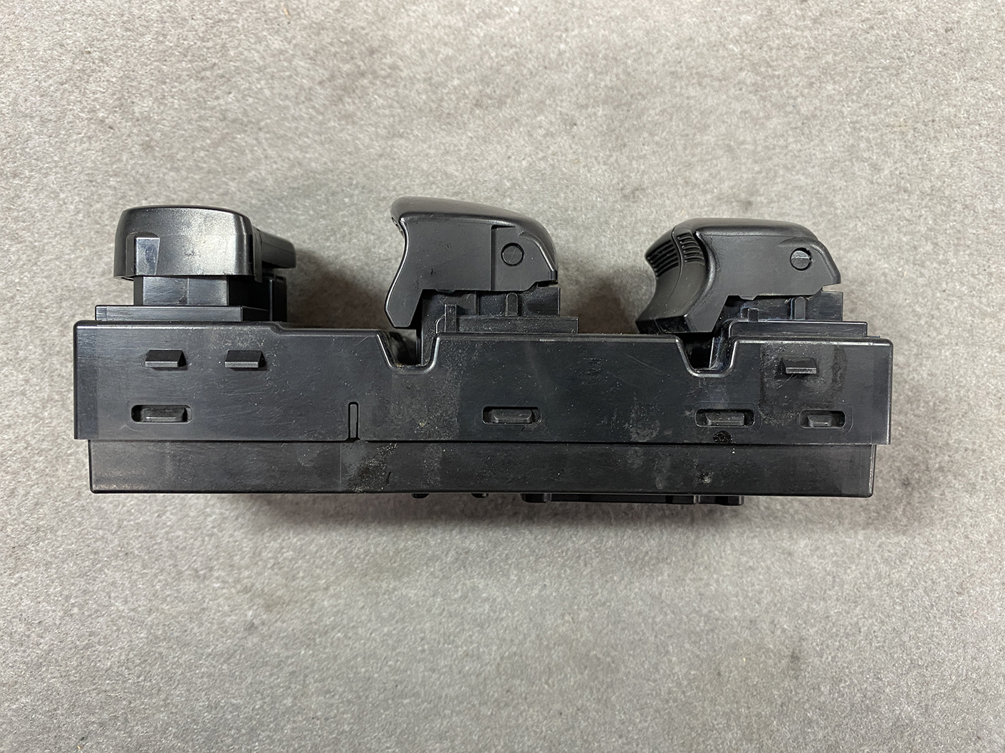 B488_8 NISSAN SERENA SUZUKI LANDY C26 Genuine Master Power Window Switch 25401 1VA7A » NZ.95 » JDM-PARTS NZ » JDM-PARTS NZ Three-lever automotive control switch module mounted on a black plastic housing. NISSAN SERENA SUZUKI LANDY C26 Genuine Master Power Window Switch 25401 1VA7A » JDM-PARTS NZ