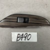 B490_2 NISSAN ELGRAND E52 Genuine Front Left Power Window Switch 25411 JD05A » NZ.95 » JDM-PARTS NZ » JDM-PARTS NZ Woodgrain finish automotive interior trim piece with a single black rectangular switch embedded in the center. NISSAN ELGRAND E52 Genuine Front Left Power Window Switch 25411 JD05A » JDM-PARTS NZ