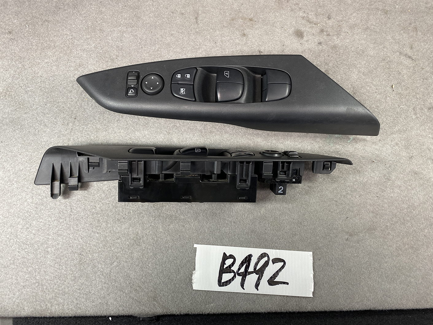 B492_2 NISSAN SERENA SUZUKI LANDY C27 Master Power Window Switch 25401 5TA0A » NZ1.95 » JDM-PARTS NZ » JDM-PARTS NZ Driver-side car door control panel with power window switches, mirror adjust knob, and lock buttons on a black molded panel. NISSAN SERENA SUZUKI LANDY C27 Master Power Window Switch 25401 5TA0A » JDM-PARTS NZ