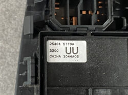 Close-up of a black electrical module with a silver ID label reading 25401 STTOA, 2200, UU, CHINA 1044A02.