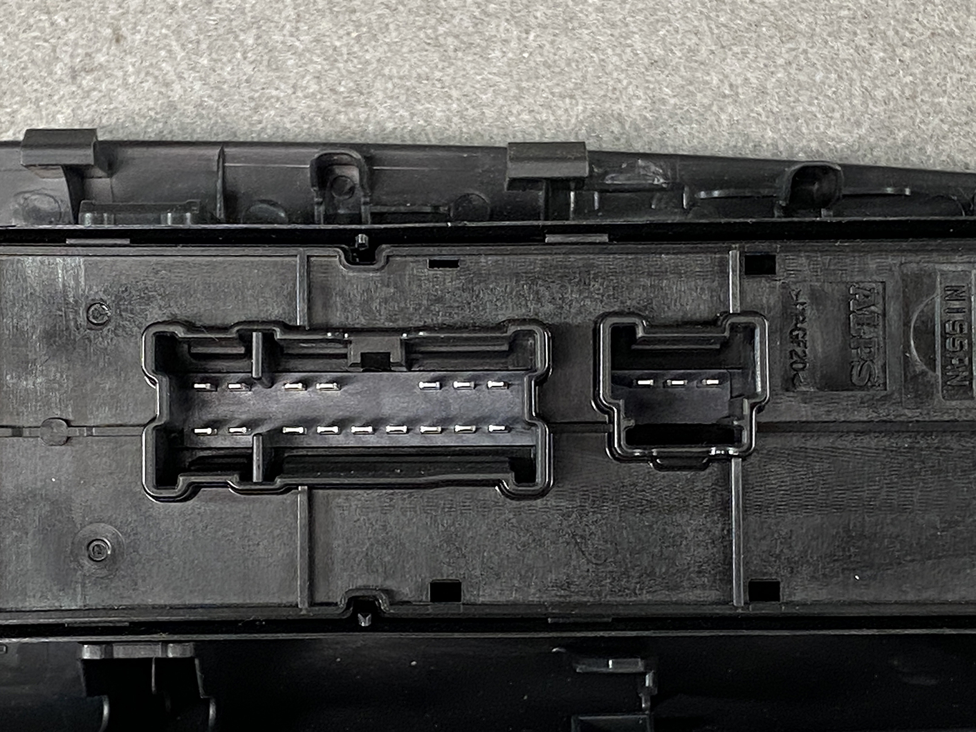 B493_6 NISSAN SERENA SUZUKI LANDY C27 Master Power Window Switch 25401 5TT0A » NZ1.95 » JDM-PARTS NZ » JDM-PARTS NZ Close-up of a black plastic connector block with two multi-pin sockets and metal contacts in the housing. NISSAN SERENA SUZUKI LANDY C27 Master Power Window Switch 25401 5TT0A » JDM-PARTS NZ