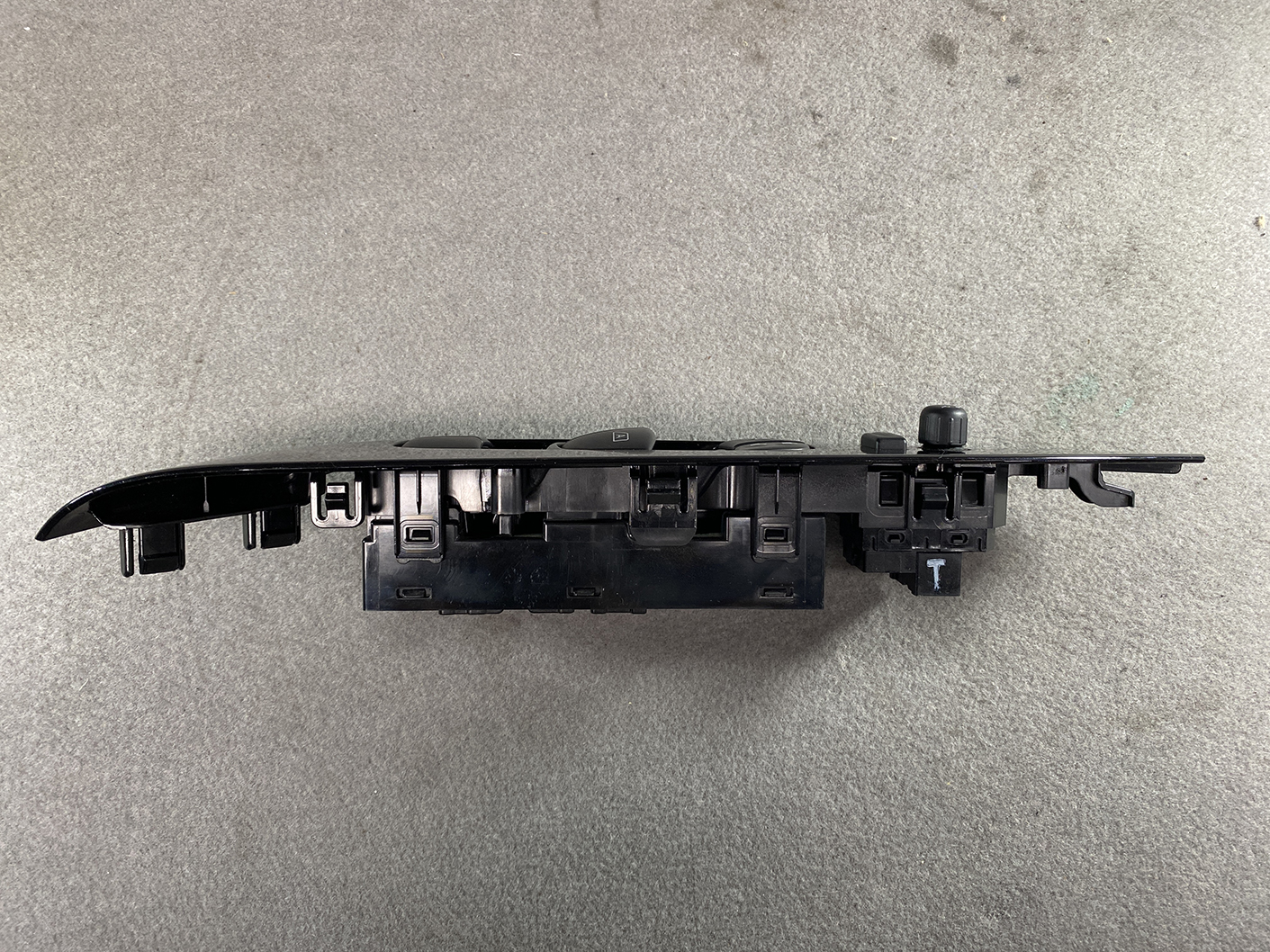 B494_9 NISSAN NOTE E11 Genuine Master Power Window Switch 25401 5SK0A » NZ.95 » JDM-PARTS NZ » JDM-PARTS NZ Black plastic automotive switch panel with multiple mounting clips, likely a control module from a car door or dash NISSAN NOTE E11 Genuine Master Power Window Switch 25401 5SK0A » JDM-PARTS NZ
