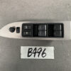 Car door interior panel with window control buttons and mirror adjuster on a brushed metal trim surface. The group includes four window switches, a central lock button, and a round mirror selector dial on the left. MAZDA DEMIO MAZDA 2 DE3FS Master Power Window Switch D652 66350B » JDM-PARTS NZ