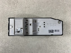 Rear view of a Toyota car stereo module, showing a grey metal chassis with mounting holes and connector slots