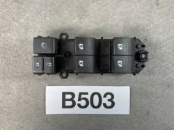 Six-button automotive window switch panel on a black plastic module.