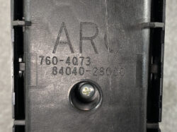 Close-up of a black plastic component with etched letters (ARD) and model numbers 760-4073 and 84040-28080, plus a central screw hole.