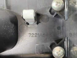 Close-up of an electrical panel interior showing a white roller switch on a metal bracket, with the part number 7221A566 stamped on the black housing.