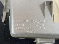 Close-up of a Subaru automotive part with ABS inscription, bearing 'Made in Japan' and part number 94266 FG520, RH side.