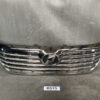 Chrome front grille of a car with a central oval badge, photographed indoors against a scratched gray backdrop TOYOTA VELLFIRE AGH30 Genuine Radiator Grille 53101-58290 /  53111-58260 » JDM-PARTS NZ