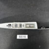 Side view of a gray car door interior panel with power window controls and lock switch on a dark surface like a workshop item SUBARU EXIGA YA5 Genuine Master Power Window Switch 94266 FG520 » JDM-PARTS NZ