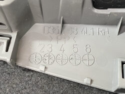 Grey plastic car interior trim piece showing part numbers (D35 38 4L1 RH) and circular markings for fastener positions 2–6 with cross/plus diagrams.