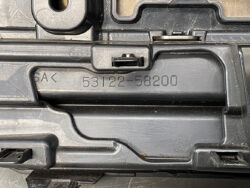 Close-up of a black plastic automotive component with the molded part number 53122-58200 and visible clips/designed features.