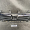 Front view of a Honda car grille with chrome emblem and horizontal slats on a dark bumper backdrop HONDA STREAM RN6 Ver.RS Z Genuine Radiator Grille » JDM-PARTS NZ
