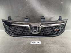 Front Honda grille with chrome trim and RSZ badge, honeycomb mesh, centered Honda emblem.