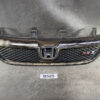 Front view of a black Honda car grille with a chrome emblem in the center and an RSZ badge on the right side. HONDA STREAM RN6 Ver.RS Z Genuine Radiator Grille » JDM-PARTS NZ