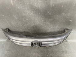 Front grille assembly for a Honda vehicle with the emblem centered in a metallic gray finish