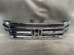 Chrome Honda front grille with the emblem center and multiple horizontal bars, shiny chrome finish.
