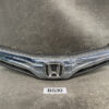 Front view of a chrome Honda car grille with emblem and black lower vents, part of a vehicle front end. HONDA FIT SHUTTLE JAZZ HYBRID GP2 Genuine Radiator Grille 71121-TF9-003 » JDM-PARTS NZ